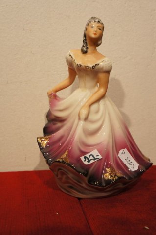 žena